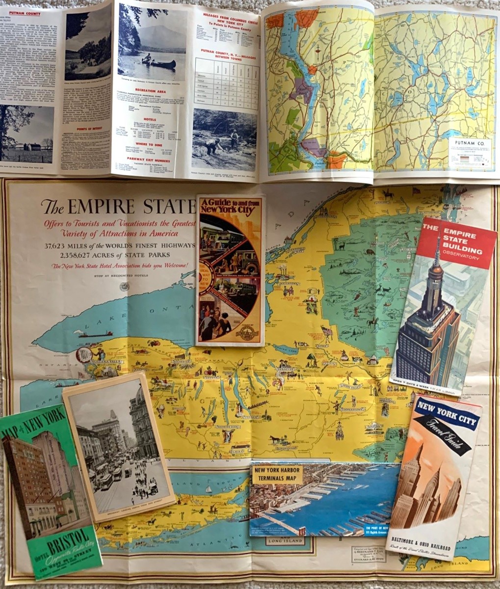 2 Map/booklets; 1 Fold-Out Map Brochure of New York Harbor; 4 Brochures. ; [Together With] 11 Views of New York Circa 1910 with Advertising for Singer Sewing Machines on the Back Side.