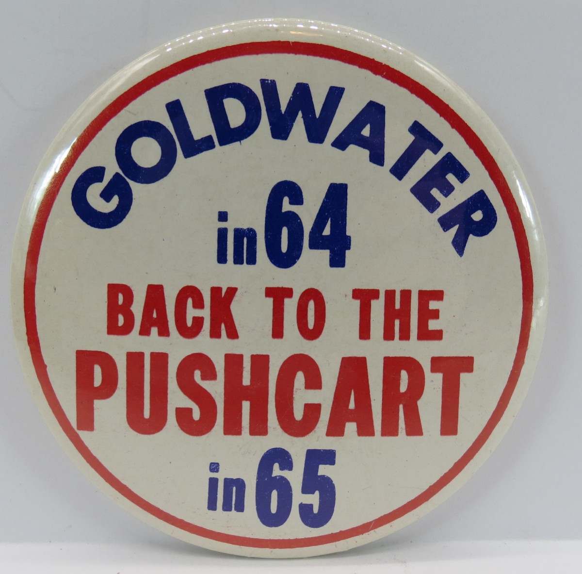 BARRY GOLDWATER IN 64 BACK TO THE PUSHCART IN 65 CAMPAIGN BUTTON 3.5