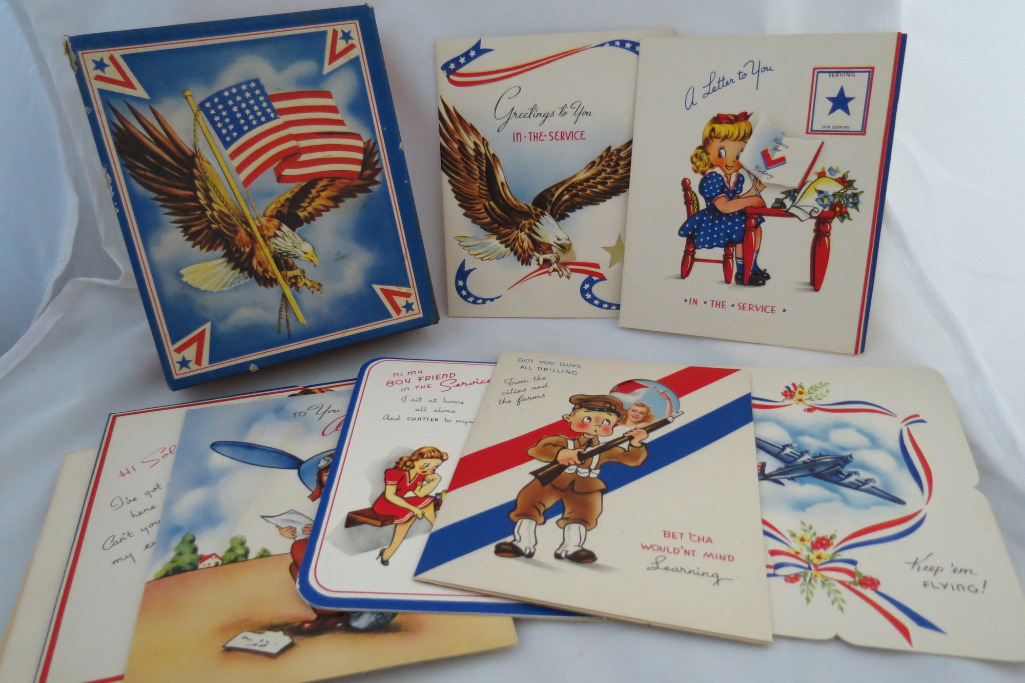 Image for WORLD WAR II (WWII) GREETING CARDS IN ORIGINAL BOX 7 Greeting Cards Including 'to My Boy Friend in the Service', 'got You Guys all Drilling', Good Luck Keep 'em Flying', 'greetings to You in the Service', 'a Letter to You in the Service', 'to You in the Airforce', 'hi Solider!