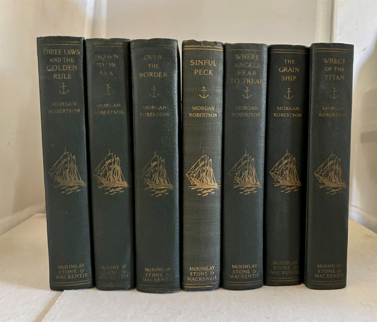 [Works] Seven Volume Set of Works by Morgan Robertson Including: over the Border, Down to the Sea, the Three Laws and the Golden Rule, Sinful Peck, Where Angels Fear to Tread, the Grain Ship, And, the Wreck of the Titan, or Futility