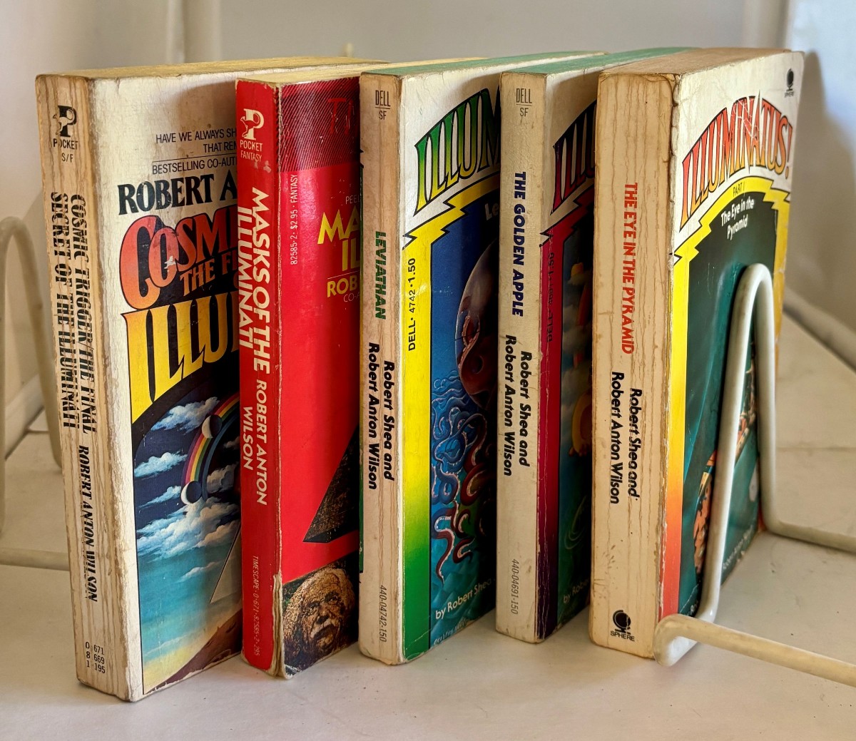 Group of 6 (Six) Books Relating to the Illuminati Series; Including: Cosmic Trigger, the Golden Apple, the Eye of the Pyramid, Leviathan, Masks of the Illuminati, And, the Illuminati Papers