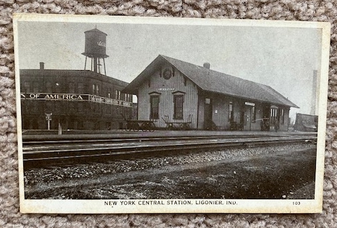 Postcard [RPPC] of Ligonier, Indiana New York Central Railroad Depot [station] [1938]